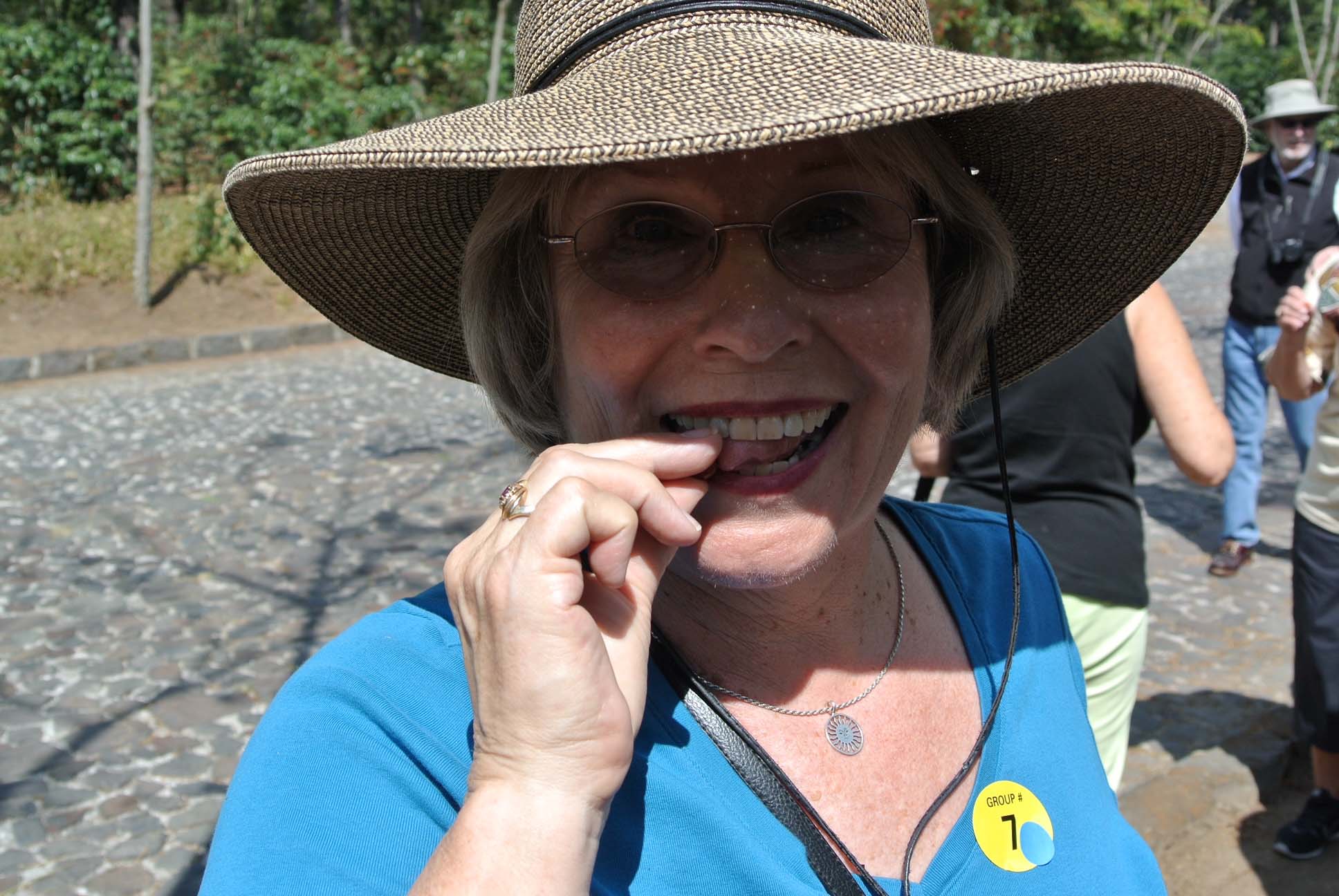 Gloria trying coffee beans in Guatamala